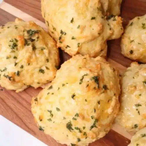 Freshly baked sourdough discard Greek yogurt cheddar biscuits on a plate
